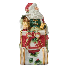 Holiday cookie jar showing Santa in green coat holding lantern, with holly accents.