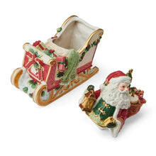 Holiday cookie jar with open top and Santa on side of decorated sleigh, red green holly.