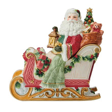 Holiday cookie jar featuring Santa figurine on sleigh with tree and teddy, red green details.