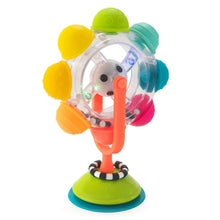 Light-up spinning suction toy with clear rainbow reel on green base and orange pole