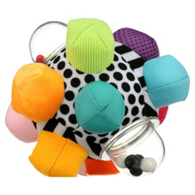 Multi-texture fabric sensory ball toy with clear rattle ring and black-dot pattern