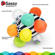 Colorful fabric sensory ball toy with multiple textures and rattle beads in clear ring
