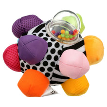 Fabric sensory ball with colorful bumpers and clear rattle ring filled with beads