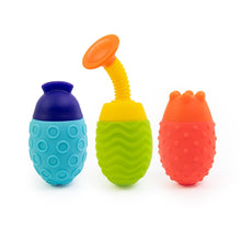 Six colorful bath scoop toys in blue, green, purple, yellow, orange, and red cups