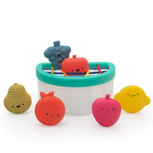 Fruit fill-and-spill STEM toy bucket with teal rim and four smiling fruit pieces