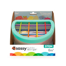Retail box for Sassy fruit fill-and-spill STEM baby toy, with teal scoop frame visible