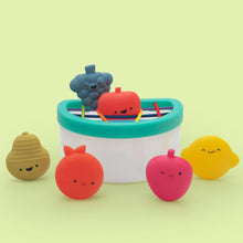 Baby fruit fill-and-spill STEM toy bucket with smiling fruit pieces and scoop frame