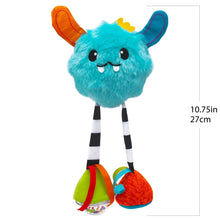 Plush blue Yeti baby toy with orange ear, striped legs, and colorful fabric feet