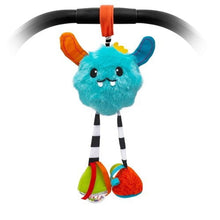 Plush blue Yeti baby toy with orange ear, striped legs, and colorful dangling feet