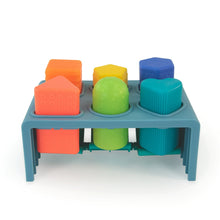 Blue press-and-pop bench with orange, green, yellow, and blue pop blocks