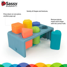 Blue press-and-pop bench with shaped, textured removable blocks and holes