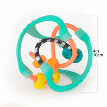 Teal sensory ball with orange ring and black striped track pieces, 4 in (10 cm)