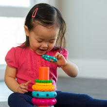 Stacking ring toy on a post, with orange, teal, green and pink rings