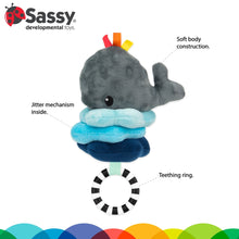 Whale plush sensory pull-down toy with soft textured body and hanging black-white ring