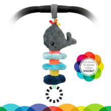 Whale plush pull-down stroller toy attached to black handle, with stacked blue ring sections