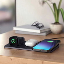 Wireless charging dock with smartwatch stand, earbuds, and gradient-screen phone