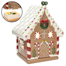 Gingerbread-style ceramic wax warmer with open tray and green wax pieces inside