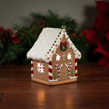 Gingerbread-style ceramic wax warmer with white roof, red stripe accents, and candy details