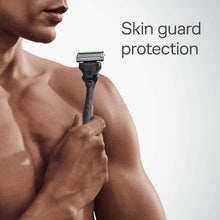 Shaving razor with skin guard protection, green-topped cartridge and gray handle