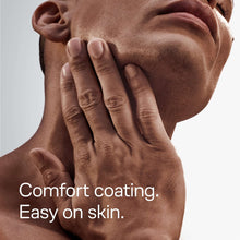 Comfort coating shaving gel on skin with hands massaging