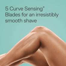 Turquoise razor shaving a woman’s leg for a smooth shave