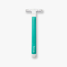Disposable men’s razor with teal textured handle and double blade head