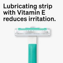 Disposable razor blade head with teal lubricating strip for vitamin E