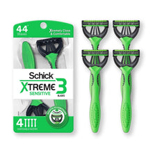 Retail package showing four green-handled disposable razors