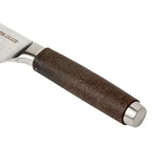 Chef knife handle detail with dark textured grip and metal end cap