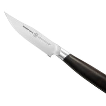 Steak knife close-up with stamped stainless blade and dark wood handle