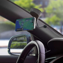 Wireless charging magnetic phone mount with smartphone attached on dashboard