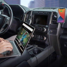 Dual USB-C car charging setup with phone connected near car dashboard outlet