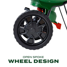 Mini spreader wheel design close-up with black treaded wheel and green frame