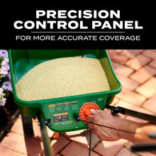 Precision control panel with orange dial on green spreader hopper