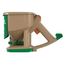 Hand-powered spreader with beige funnel, green base, and orange side knobs