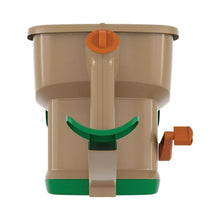 Hand-powered spreader top with orange dial and green distribution gate