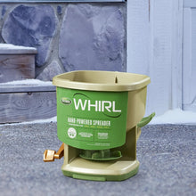 Hand-powered Whirl spreader with WHIRL label, green hopper insert, and orange lever