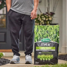Southern lawn food bag standing upright next to a person holding it