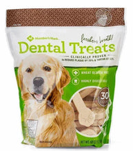 Dog dental chew treats bag, green and white front with dog graphic and dental treats text