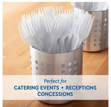 White plastic forks in a dispenser cup for events