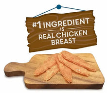 Chicken jerky treats on wooden board, real chicken breast