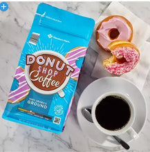 Ground coffee bag with cup of coffee and pink frosted donut, Donut Shop Coffee