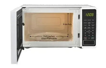 Countertop microwave oven with open door showing glass turntable interior