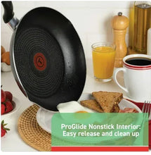 Grey nonstick frying pan with textured interior and red circular heat indicator