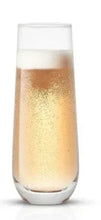 Stemless champagne flute, clear stemless glass with frosted base, filled with sparkling drink