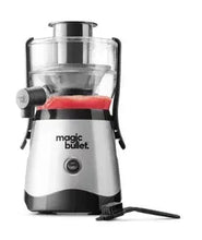 Mini juicer with clear blending cup, silver body and black base, side handles.