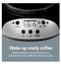 Black and silver coffee maker control panel with LCD clock and auto on/off buttons