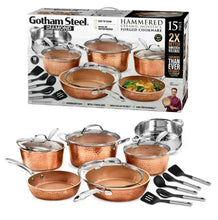 Hammered copper cookware set with box, pots, pans, lids, and included utensils