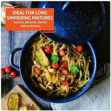 Blue speckled enamel stock pot with lid, filled with noodles and vegetables