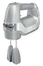 Silver electric hand mixer with two beaters attached